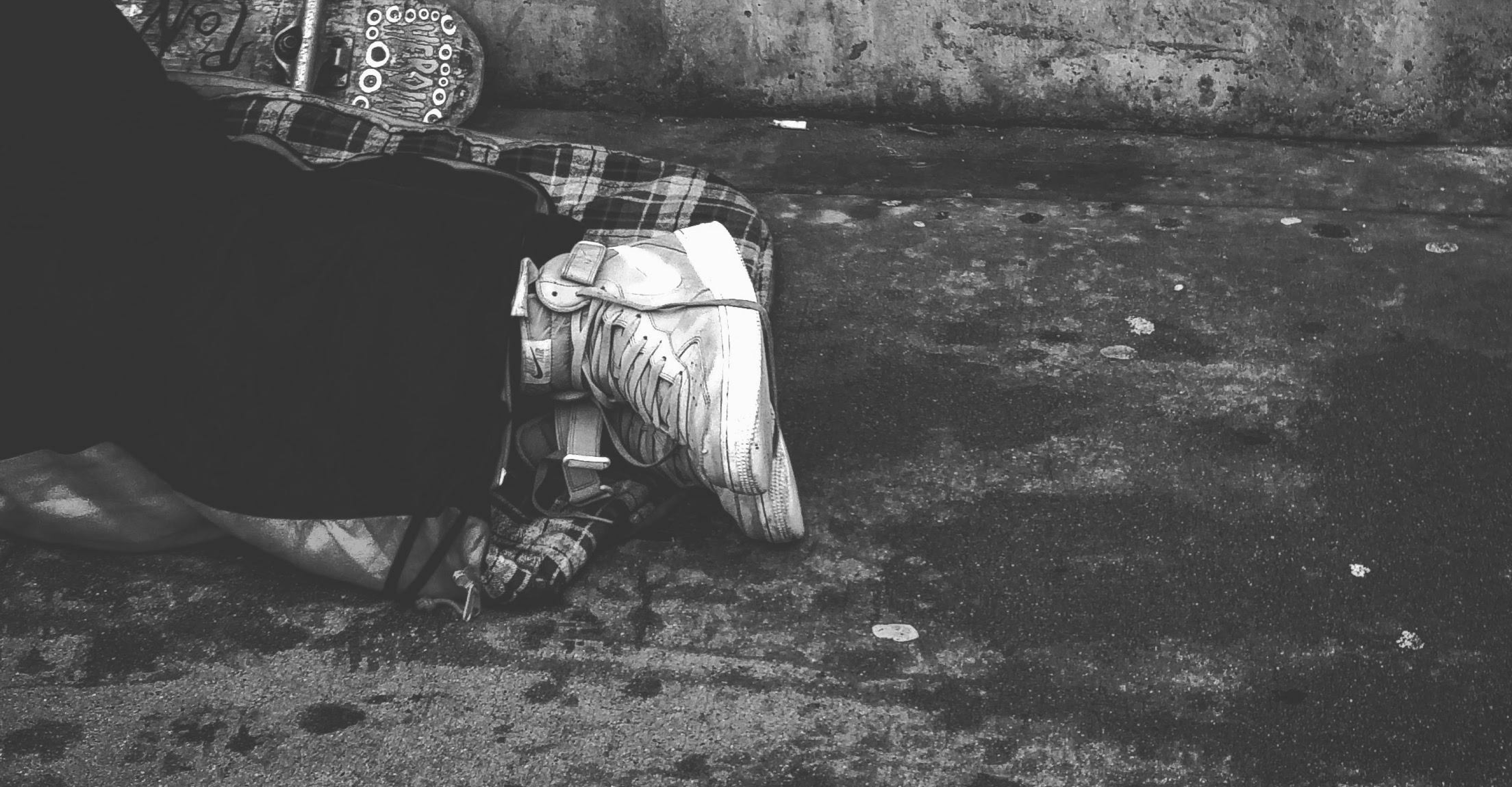 Person homeless laying on the ground