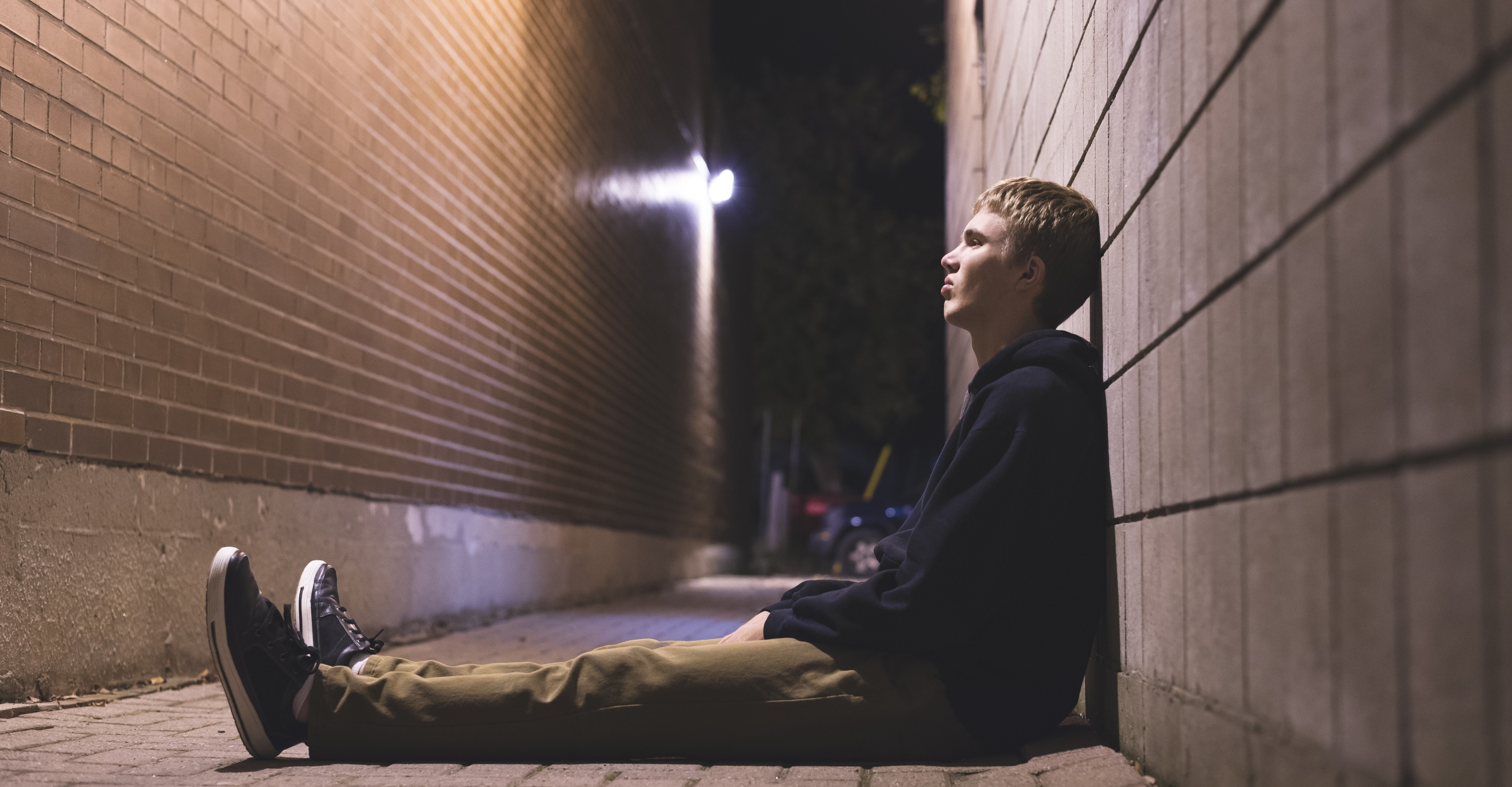 Young boy sitting on floor 